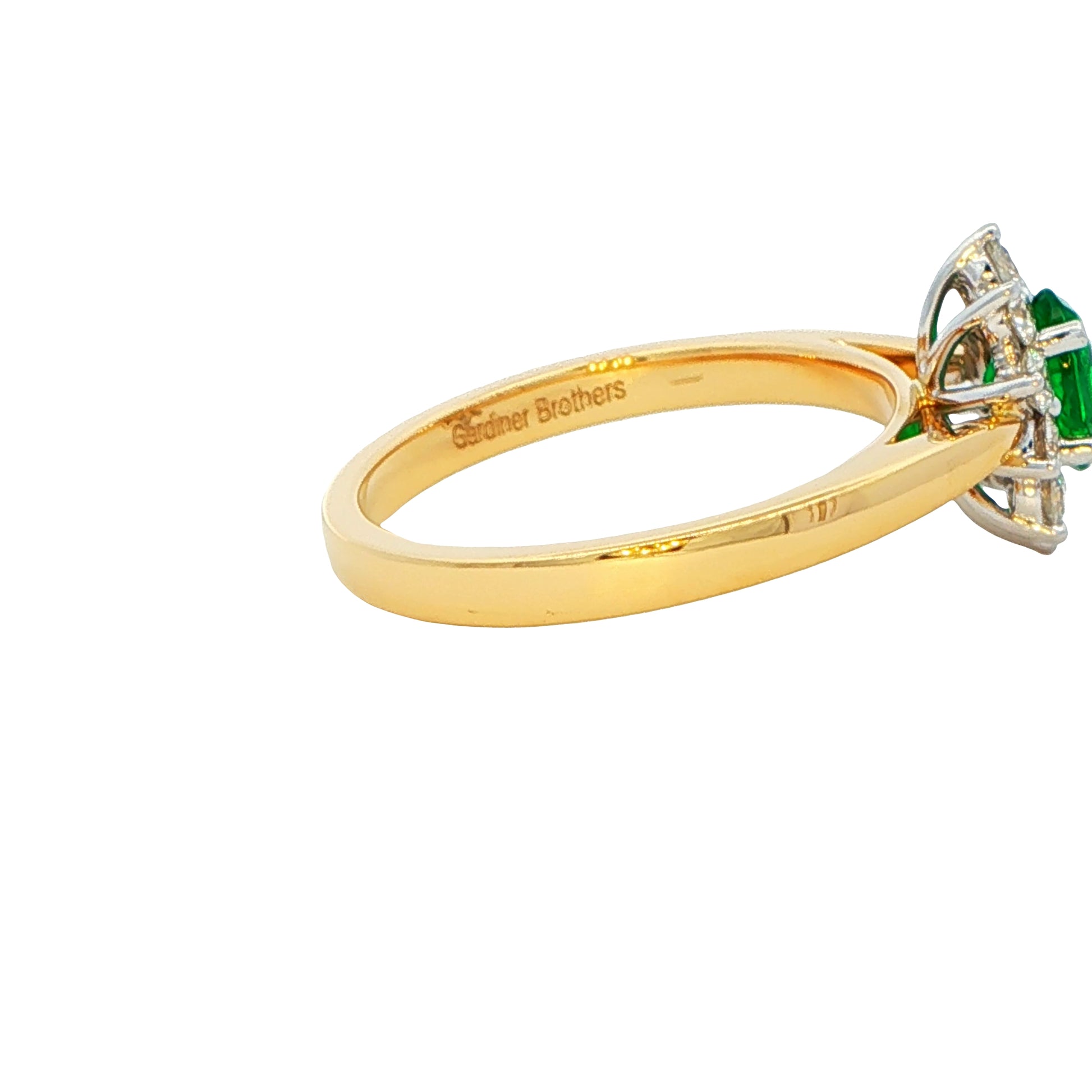 Emerald and round brilliant cut diamond cluster ring Gardiner Brothers