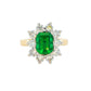 Octagonal shaped Emerald and round brilliant cut diamond cluster style ring Gardiner Brothers