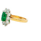 Octagonal shaped Emerald and round brilliant cut diamond cluster style ring Gardiner Brothers