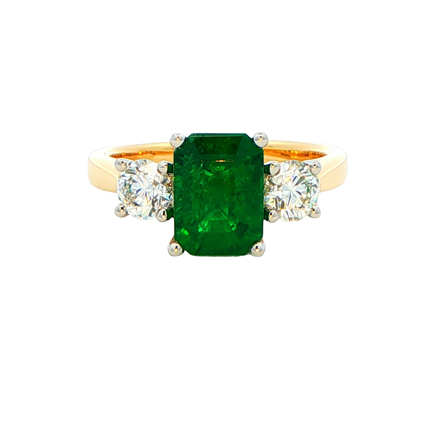 Octagonal emerald and round brilliant cut diamond 3 stone ring Gardiner Brothers