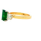 Octagonal emerald and round brilliant cut diamond 3 stone ring Gardiner Brothers