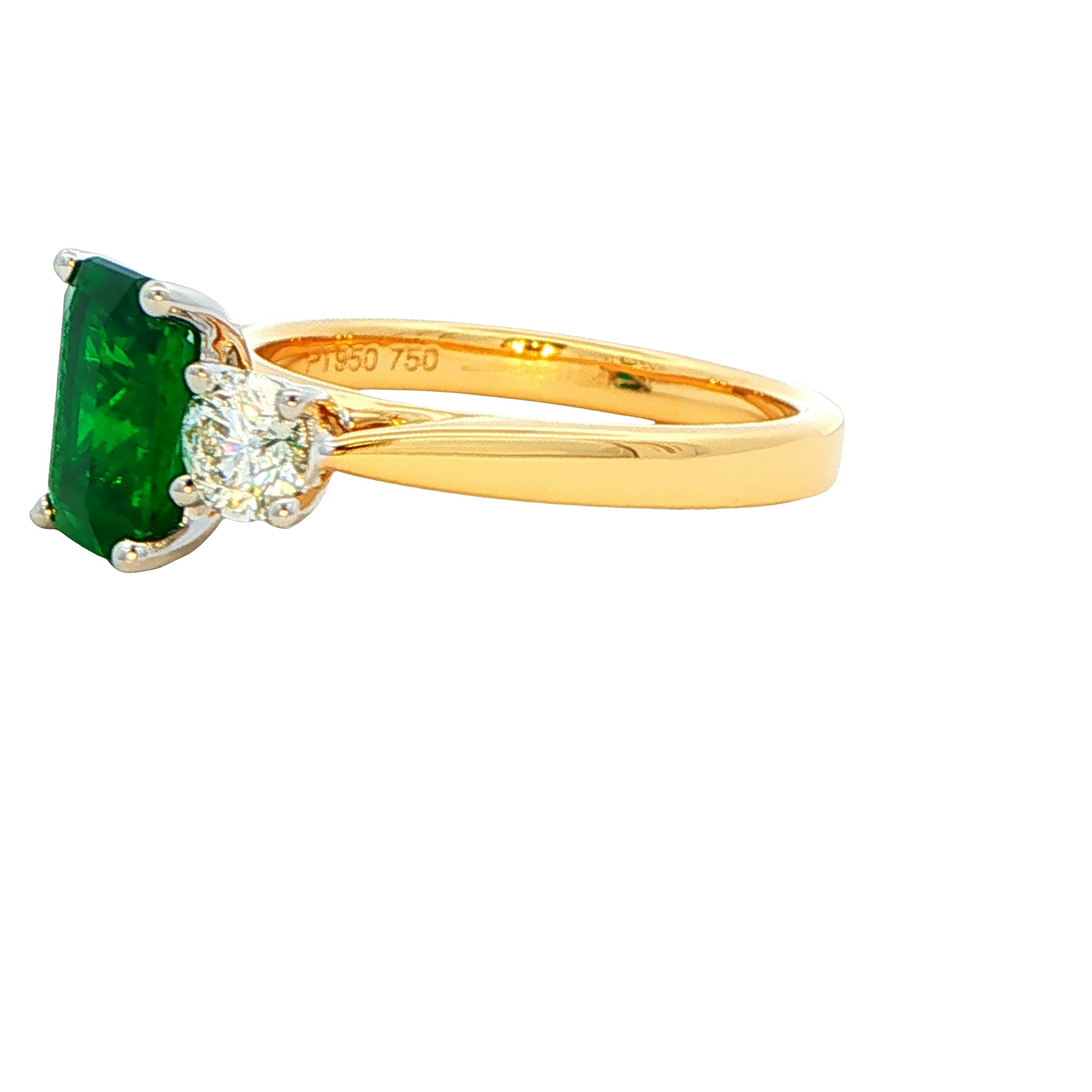 Octagonal emerald and round brilliant cut diamond 3 stone ring Gardiner Brothers