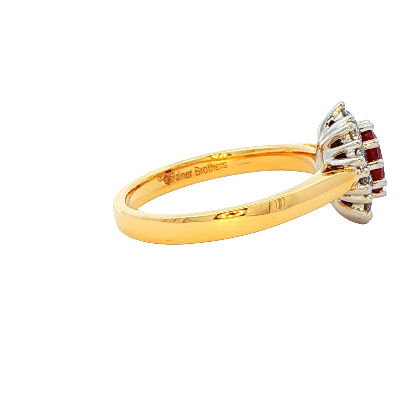 Oval Shaped Ruby and round brilliant cut diamond cluster style ring Gardiner Brothers
