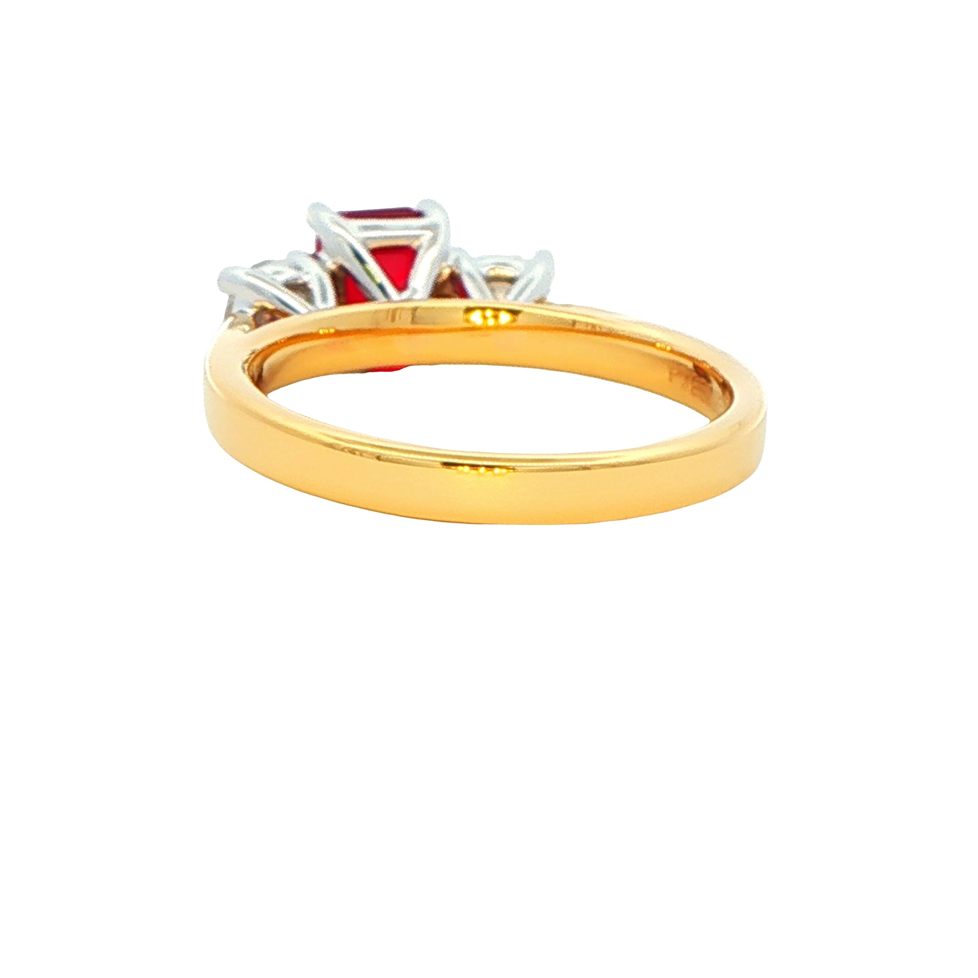 Octagonal Ruby and round brilliant cut diamond 3 stone ring Gardiner Brothers