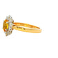 Oval Shaped Yellow Sapphire and round brilliant cut diamond cluster ring Gardiner Brothers