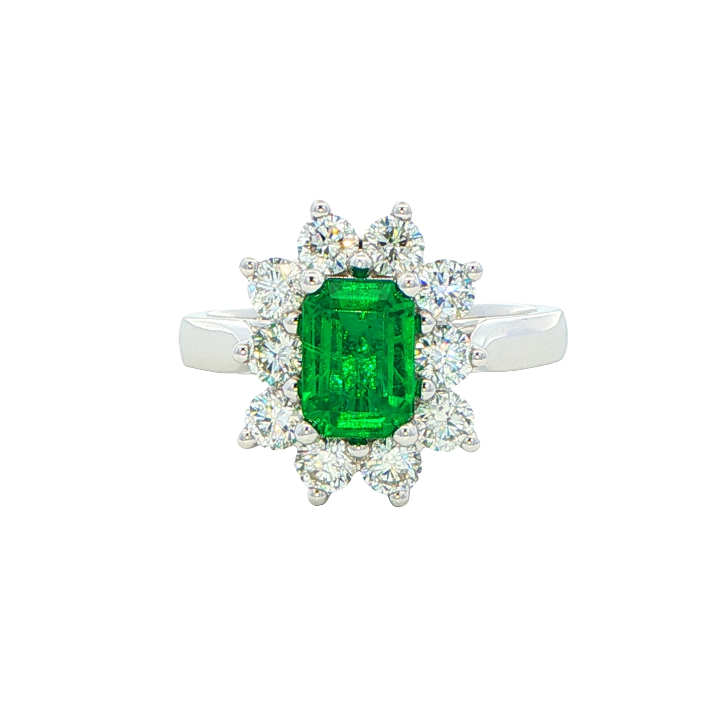 Octagonal shaped emerald and round brilliant cut diamond cluster style ring Gardiner Brothers