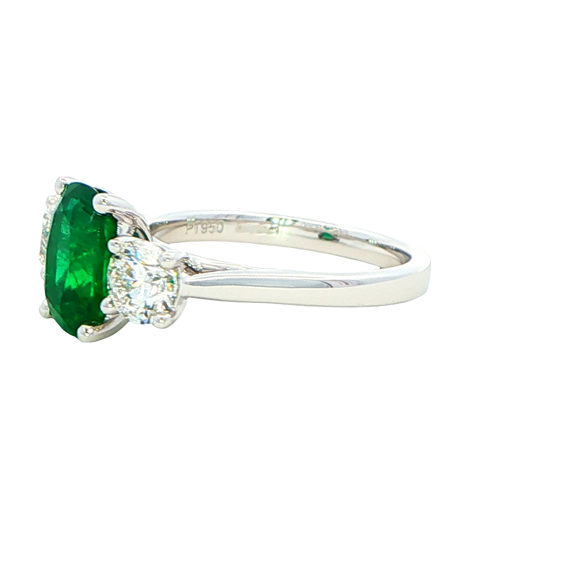 Cushion shaped emerald and round brilliant cut diamond 3 stone ring Gardiner Brothers