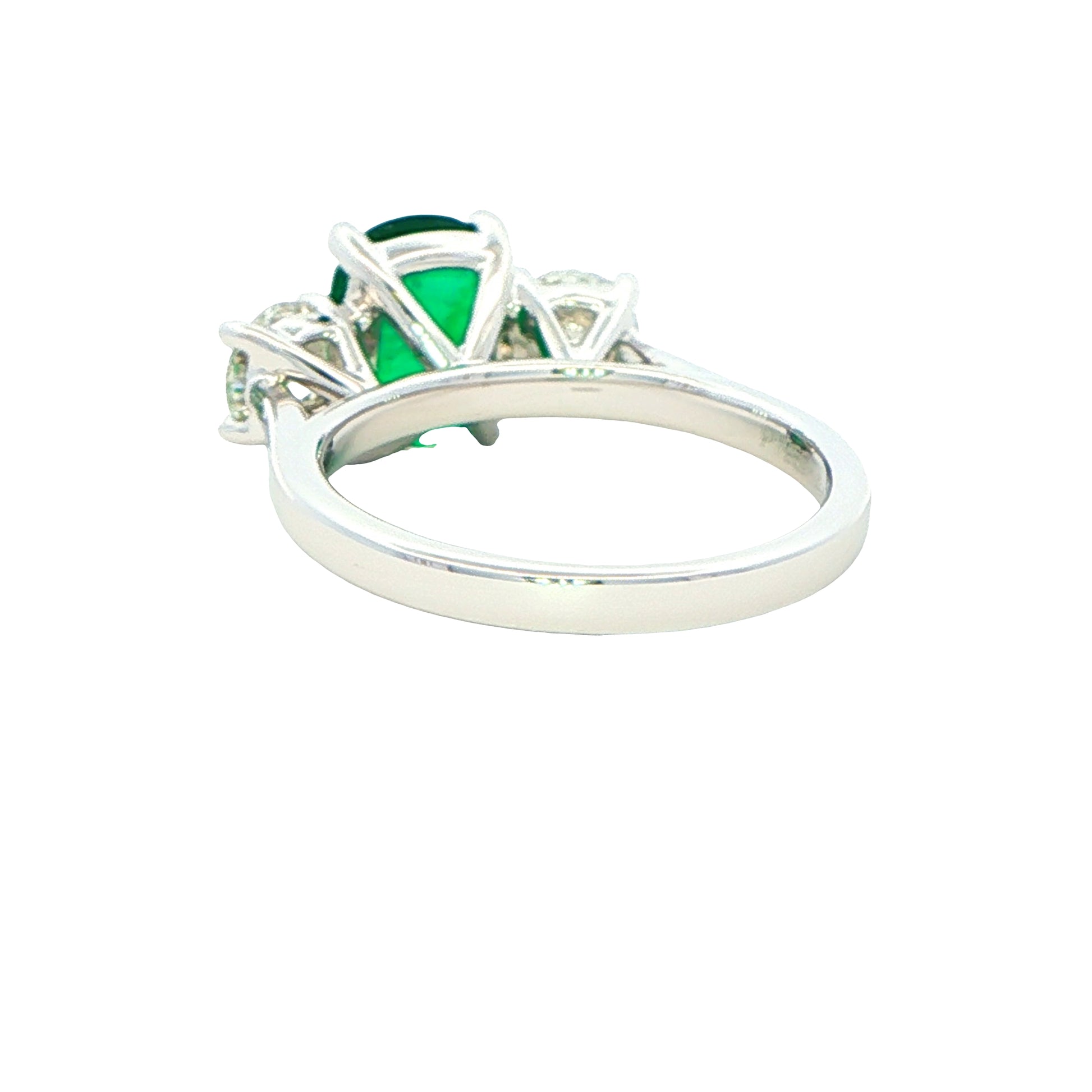 Cushion shaped emerald and round brilliant cut diamond 3 stone ring Gardiner Brothers