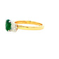 Oval shaped emerald and oval diamond 3 stone ring Gardiner Brothers