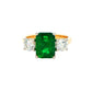 Octagonal shaped emerald and round brilliant cut diamond 3 stone ring Gardiner Brothers