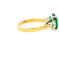 Octagonal shaped emerald and round brilliant cut diamond 3 stone ring Gardiner Brothers