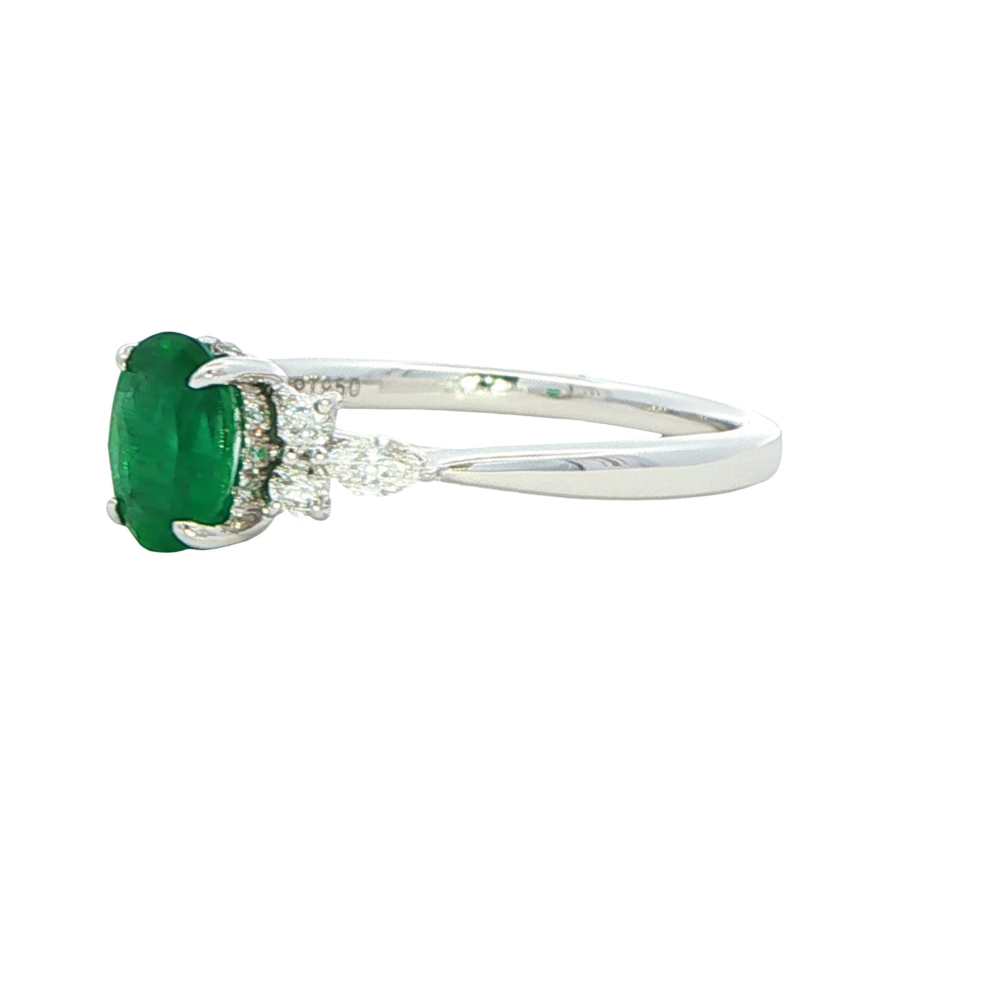Oval shaped emerald with brilliant and marquise shaped diamond shoulders Gardiner Brothers