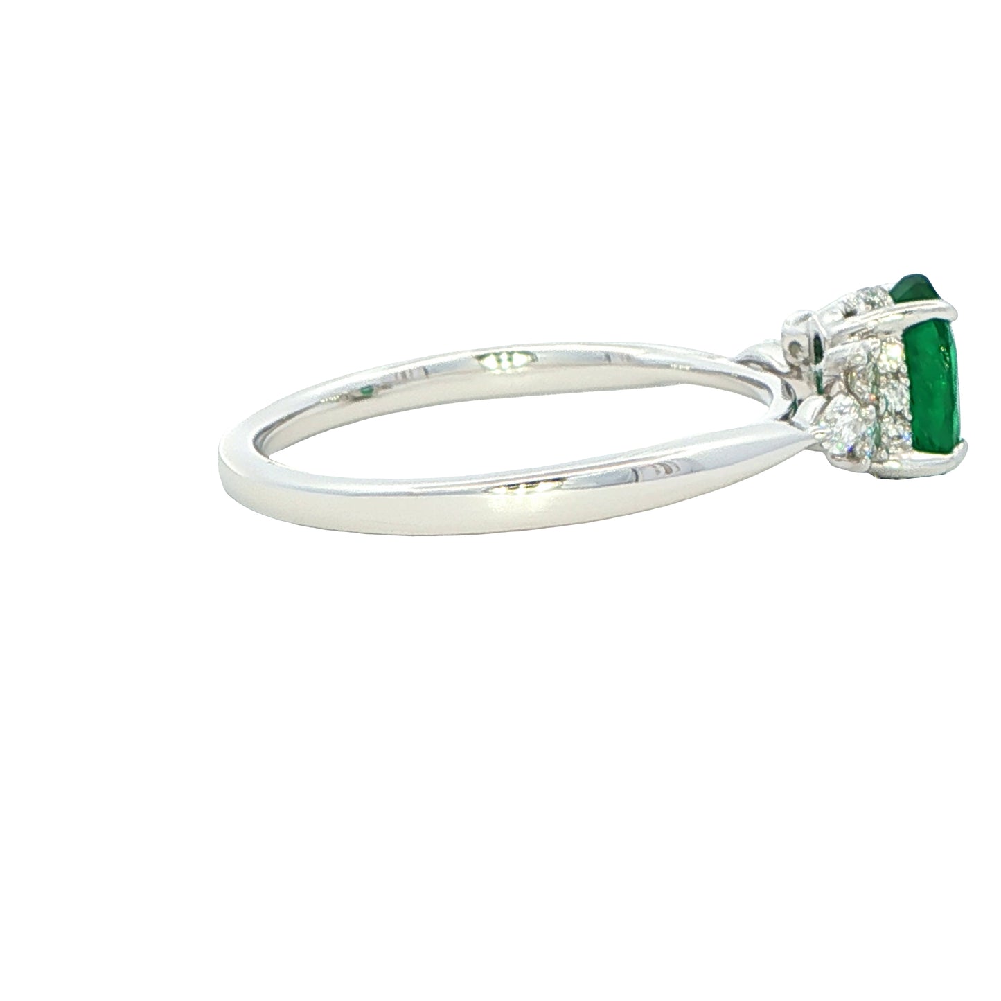 Oval shaped emerald with brilliant and marquise shaped diamond shoulders Gardiner Brothers