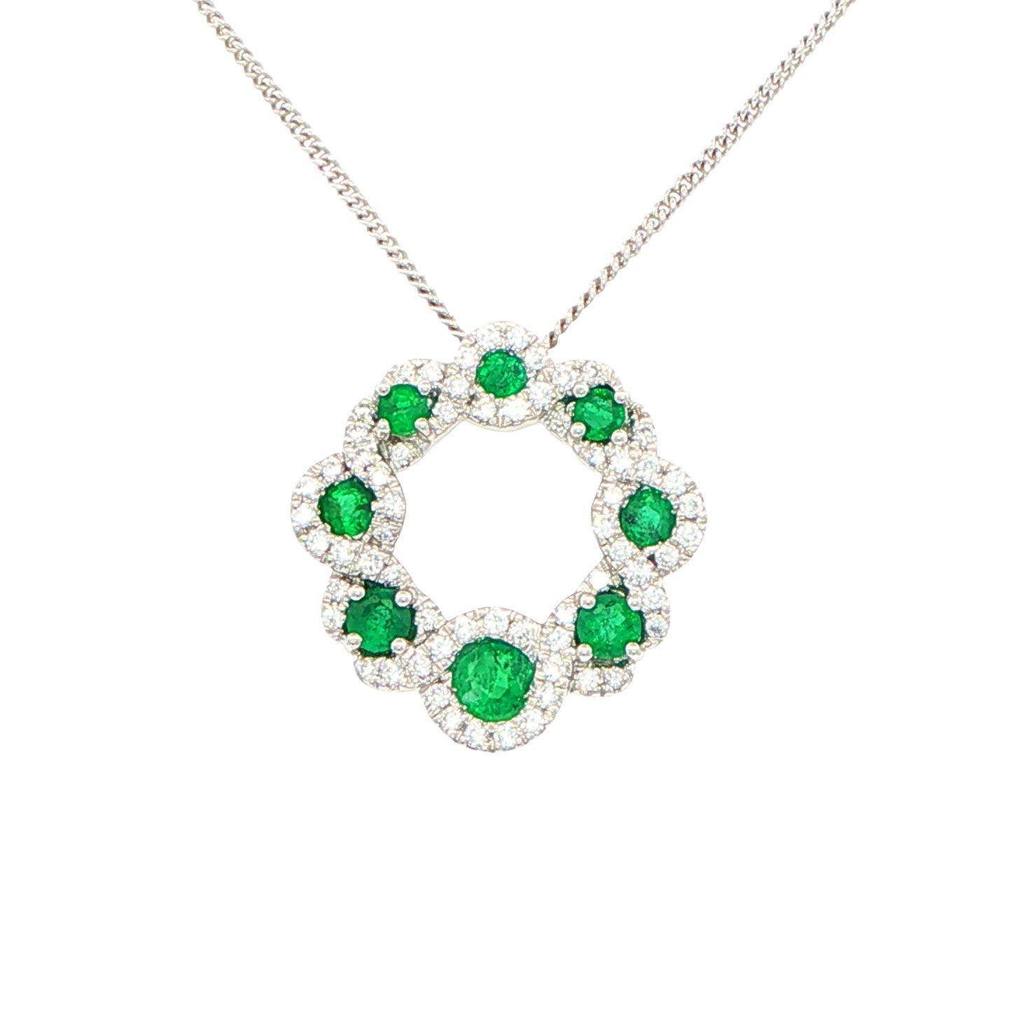 Emerald and diamond halo style circle pendant Gardiner Brothers