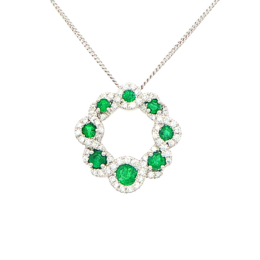 Emerald and diamond halo style circle pendant Gardiner Brothers