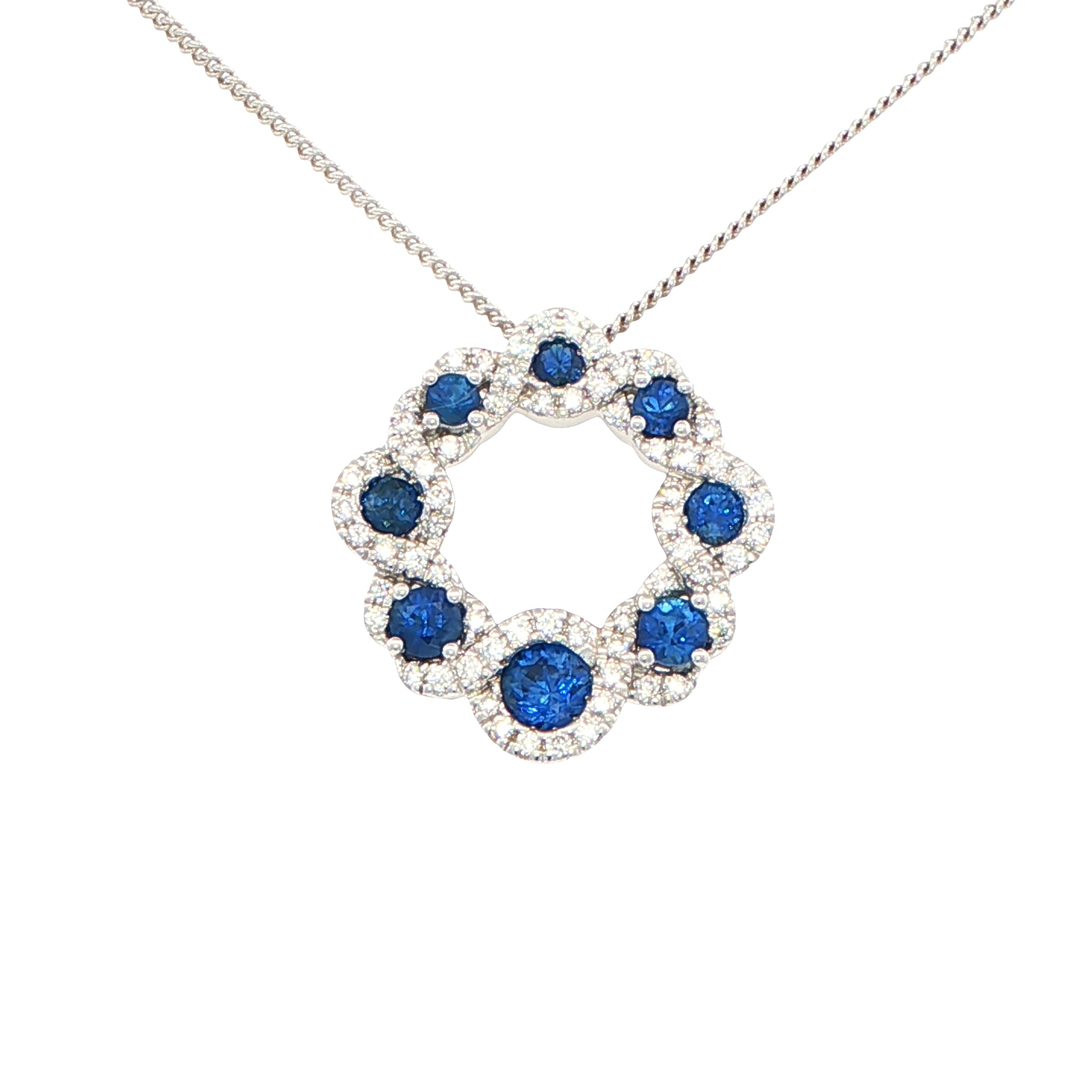 Sapphire and round brilliant cut diamond halo style circle pendant Gardiner Brothers