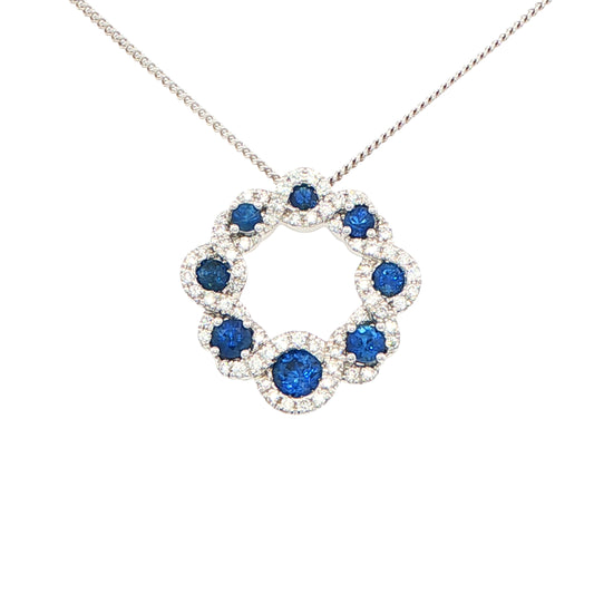 Sapphire and round brilliant cut diamond halo style circle pendant Gardiner Brothers