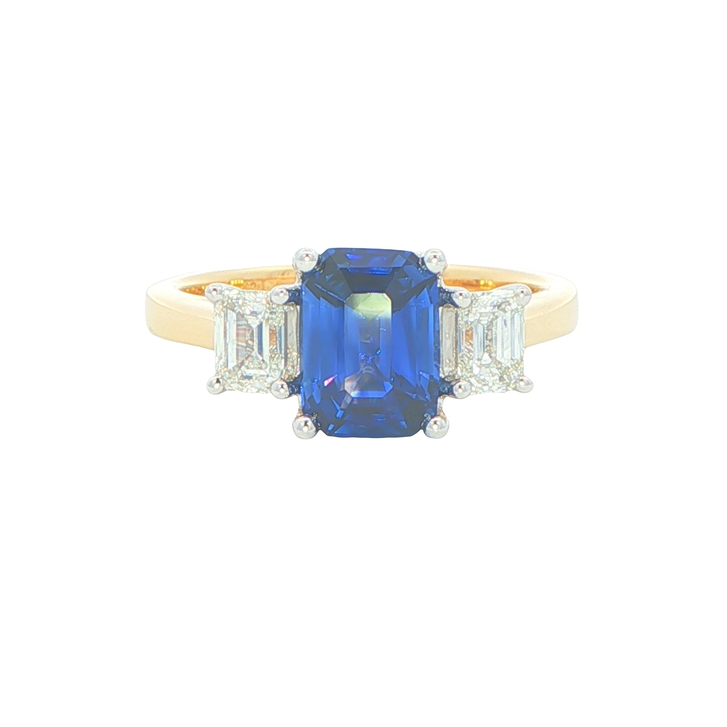 Octagonal shaped Sapphire and emerald cut diamond 3 stone ring