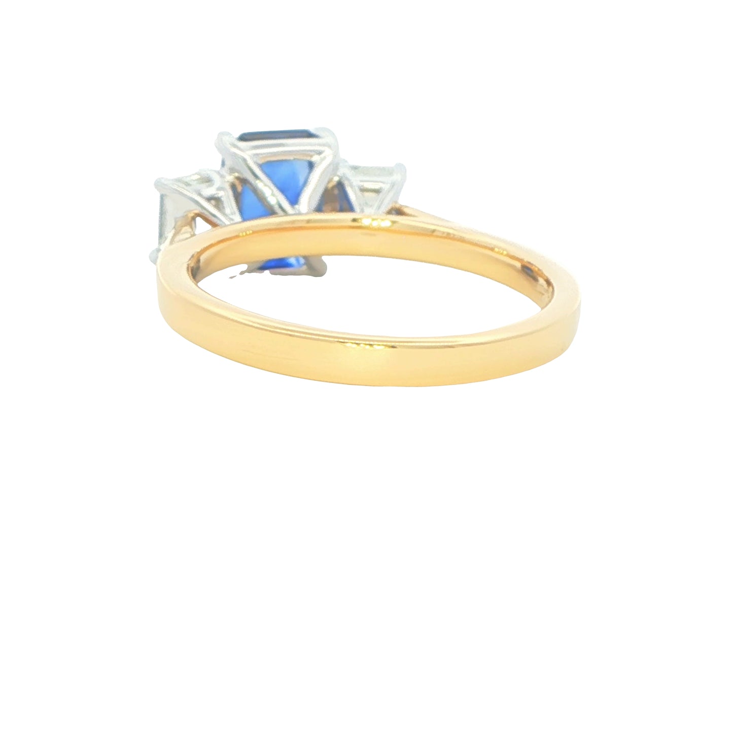 Octagonal shaped Sapphire and emerald cut diamond 3 stone ring