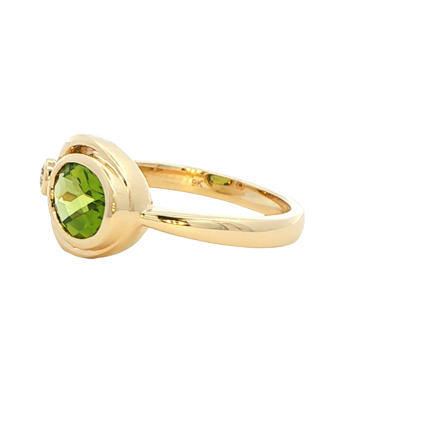 Oval shaped Peridot and round brilliant cut diamond dress ring Gardiner Brothers