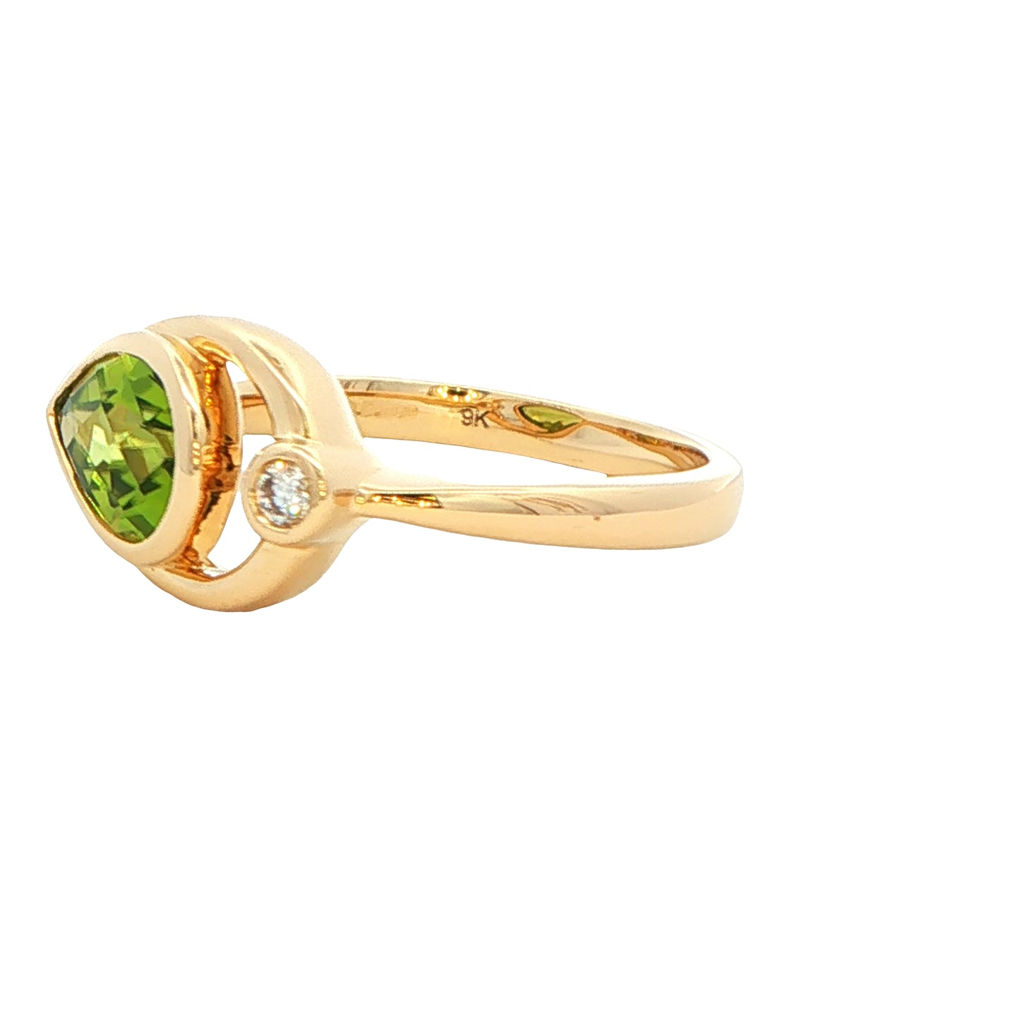 Pear shaped Peridot and round brilliant cut diamond dress ring Gardiner Brothers