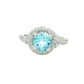 Aquamarine and round brilliant cut diamond halo cluster ring