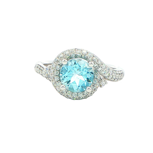 Aquamarine and round brilliant cut diamond halo cluster ring