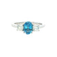 Oval shaped Aquamarine and round brilliant cut diamond 3 stone ring
