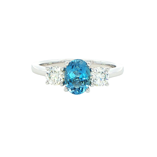 Oval shaped Aquamarine and round brilliant cut diamond 3 stone ring