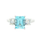 Octagonal shaped aquamarine and round brilliant cut diamond 3 stone ring Gardiner Brothers