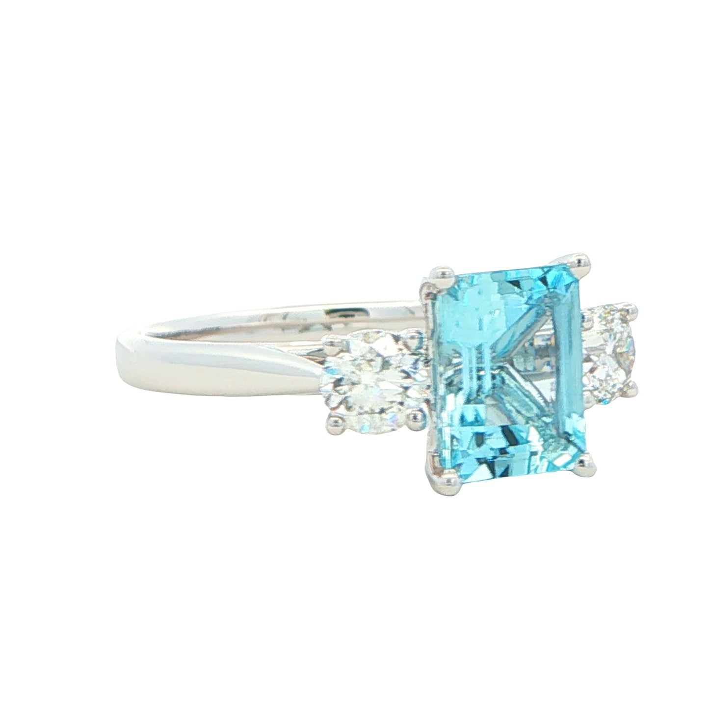 Octagonal shaped aquamarine and round brilliant cut diamond 3 stone ring Gardiner Brothers