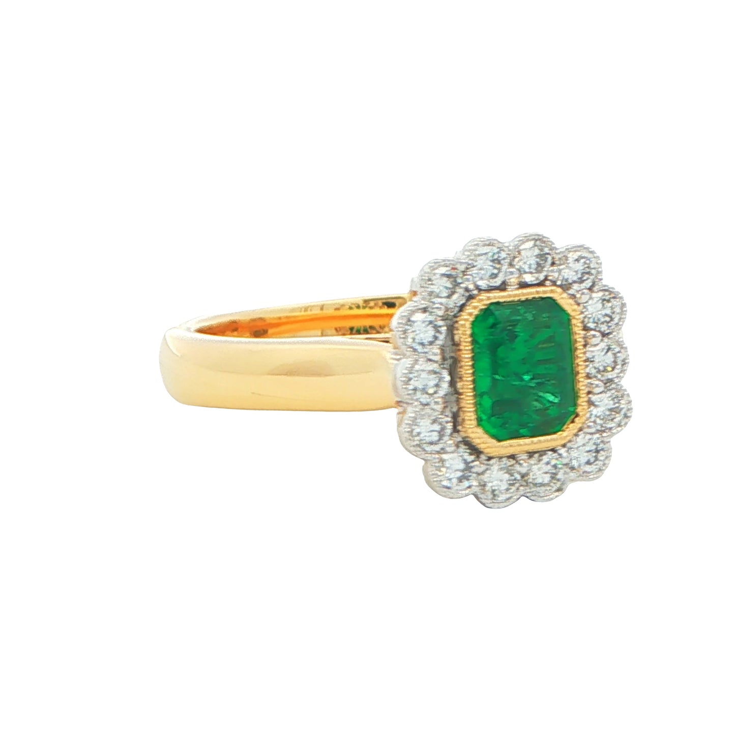 Octagonal Emerald and round brilliant cut diamond vintage cluster style ring Gardiner Brothers