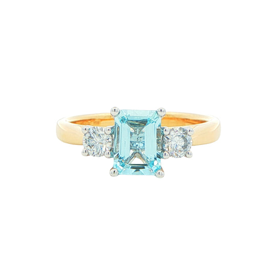 Octagonal Aquamarine and round brilliant cut diamond 3 stone ring