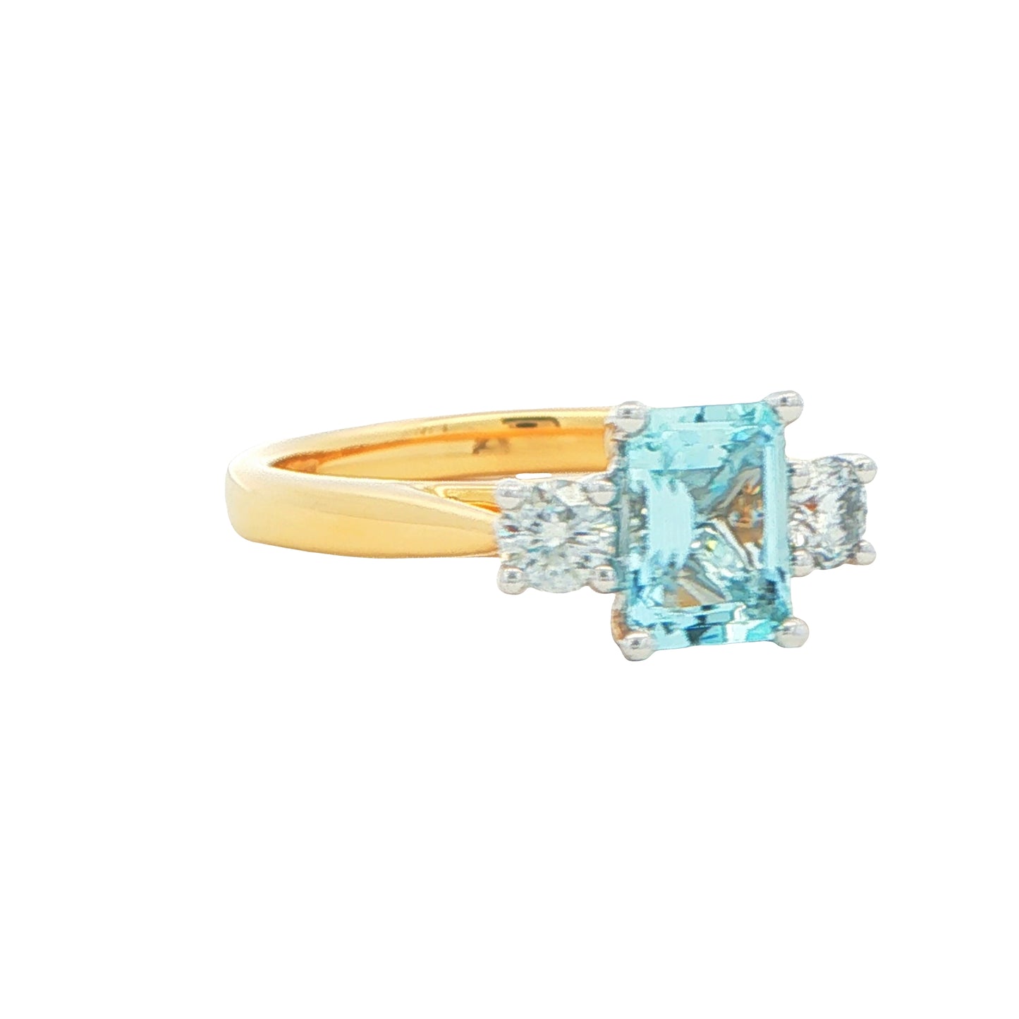 Octagonal Aquamarine and round brilliant cut diamond 3 stone ring