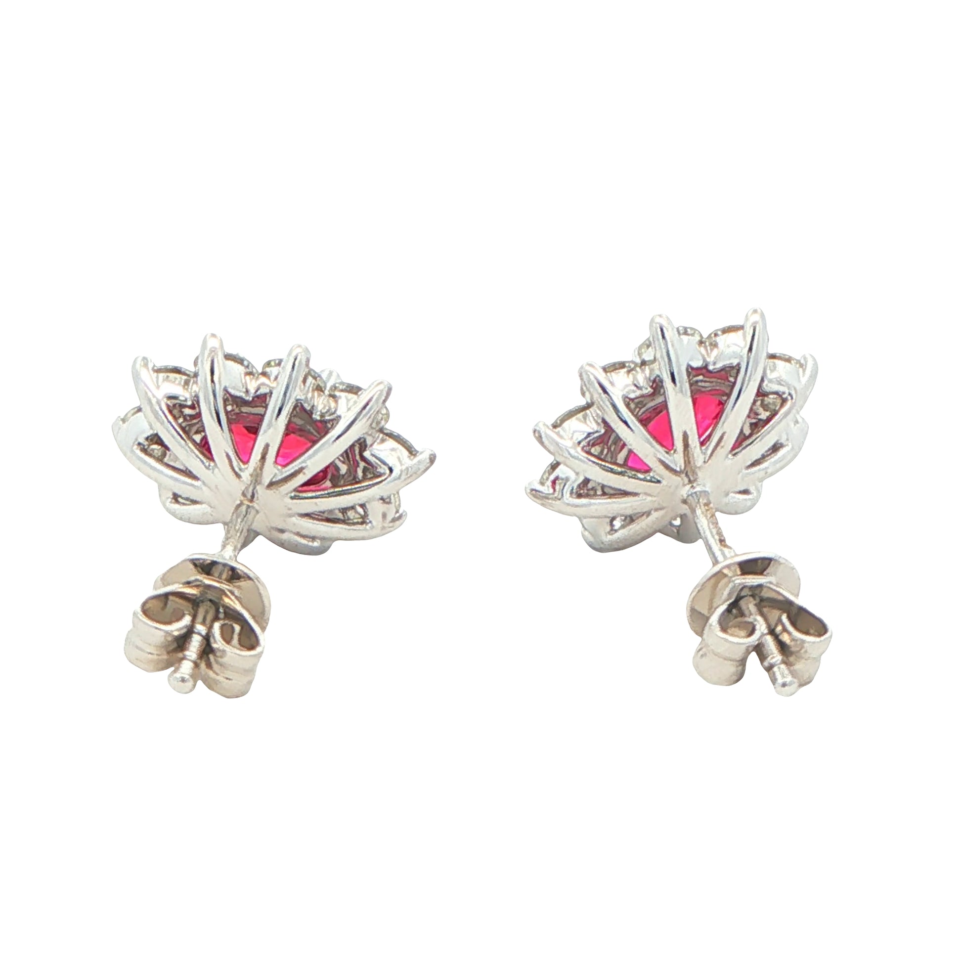 Oval shaped ruby and round brilliant cut diamond cluster style earrings Gardiner Brothers