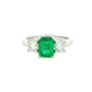 Octagonal shaped emerald and round brilliant cut diamond 3 stone ring Gardiner Brothers