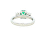 Octagonal shaped emerald and round brilliant cut diamond 3 stone ring Gardiner Brothers