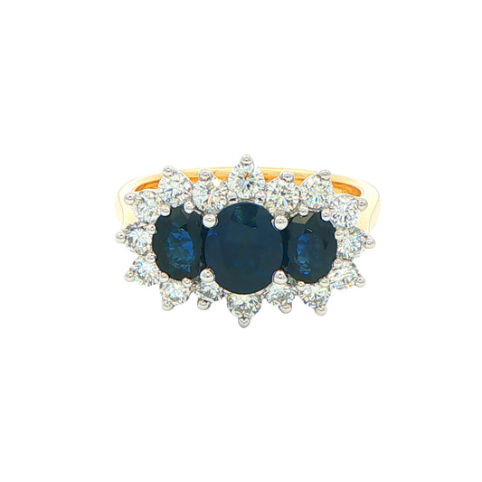 Oval Shaped Sapphire and Diamond Cluster Style Ring Gardiner Brothers