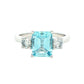 Octagonal Aquamarine and round brilliant cut diamond 3 stone ring Gardiner Brothers