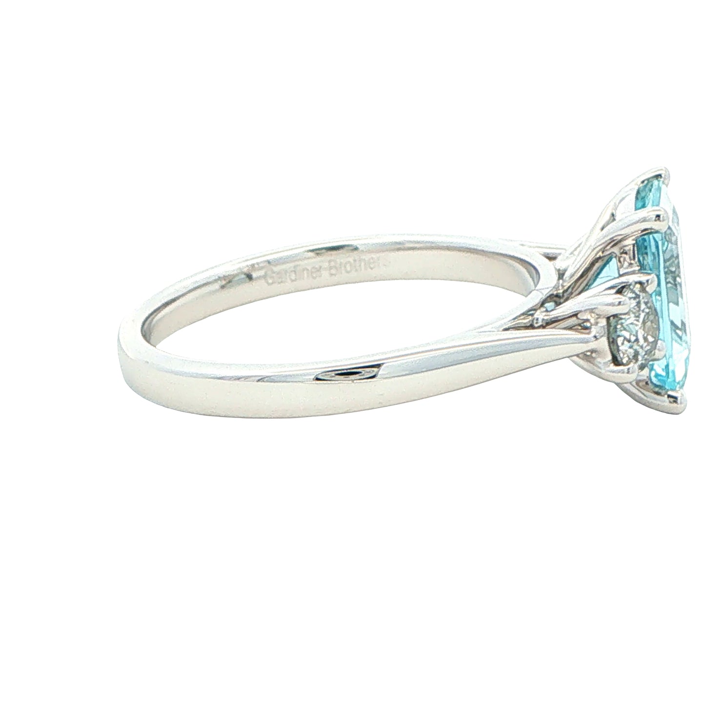 Octagonal Aquamarine and round brilliant cut diamond 3 stone ring Gardiner Brothers