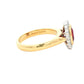 Oval ruby and round brilliant cut diamond vintage style cluster ring Gardiner Brothers