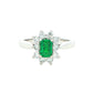 Octagonal shaped emerald and round brilliant cut diamond cluster style ring