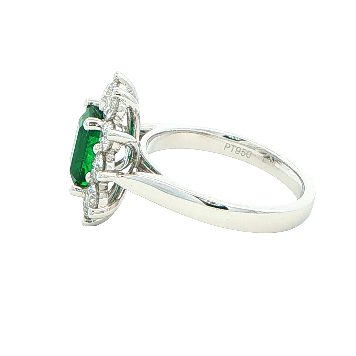 Octagonal shaped emerald and round brilliant cut diamond cluster style ring