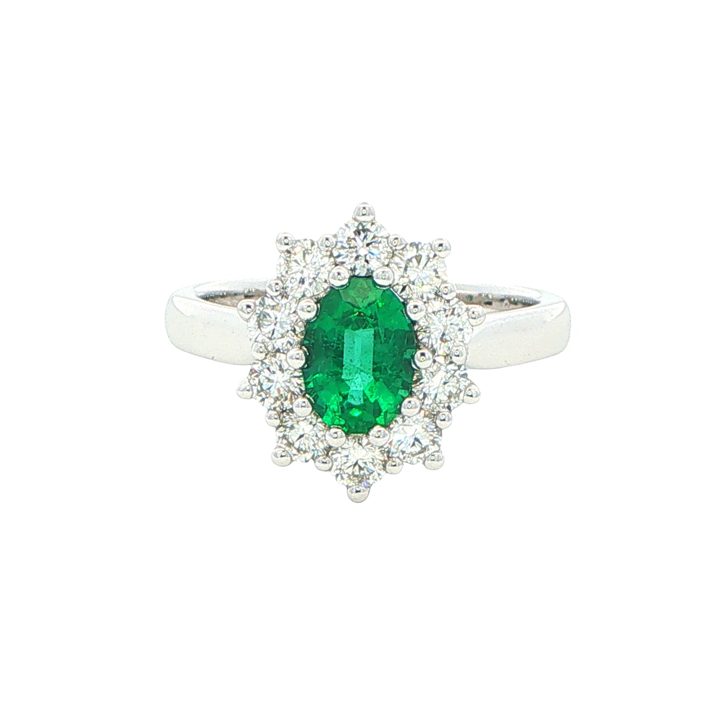 Emerald and round brilliant cut diamond cluster style ring