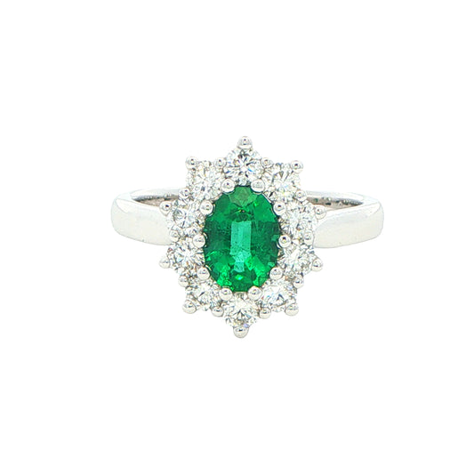 Emerald and round brilliant cut diamond cluster style ring