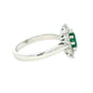 Emerald and round brilliant cut diamond cluster style ring