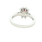 Octagonal shaped ruby and round brilliant cut diamond cluster ring