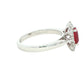 Octagonal shaped ruby and round brilliant cut diamond cluster ring