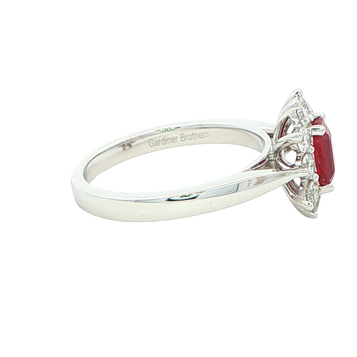 Octagonal shaped ruby and round brilliant cut diamond cluster ring