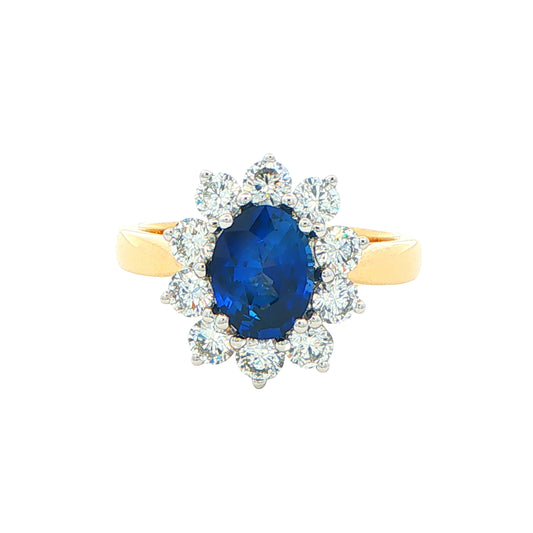 SAPPHIRE AND ROUND BRILLIANT CUT DIAMOND CLUSTER STYLE RING